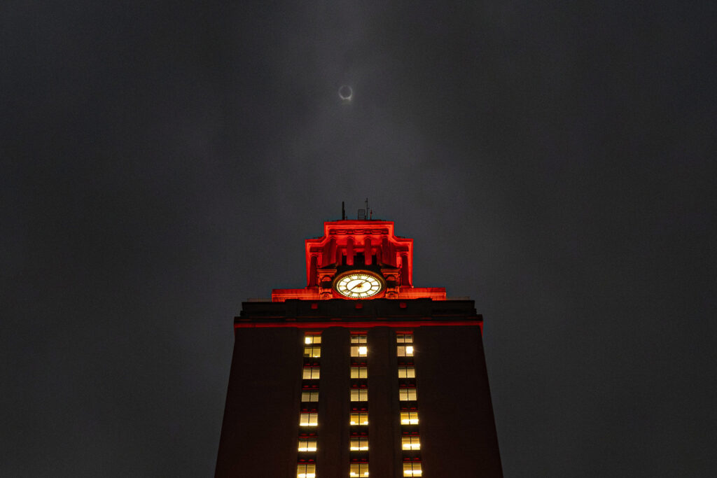 Looking up at the UT Tower during eclipse totality above the Tower is the diamond ring effect during the total eclipse of the sun.
