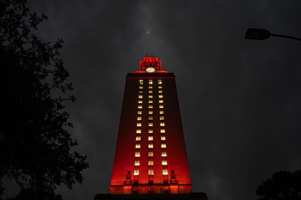 Looking up at the UT Tower during eclipse totality above the Tower is the diamond ring effect during the total eclipse of the sun.